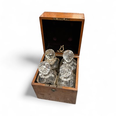 Lot 60 - Victorian mahogany cased set of four cut glass decanters, with brass plaque engraved 'Manufactured for H.M. Emanuel & Son, Silversmiths to the Queen, Ordnance Row, Portsea'