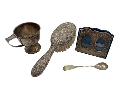 Lot 970 - 1930s silver cup (Birmingham 1936), silver backed dressing table brush, silver double photograph frame and a plated spoon