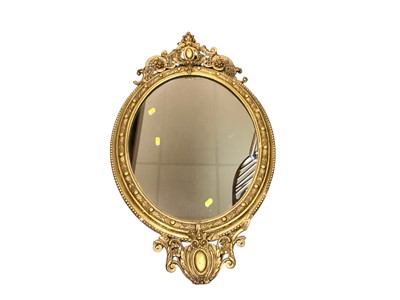Lot 1460 - Good quality oval wall mirror in ornate gilt frame, 98cm x 57cm