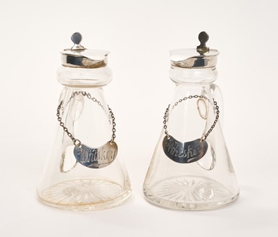 Lot 407 - Two silver mounted glass whisky tots with silver labels