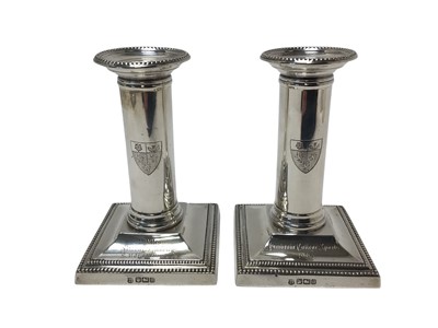 Lot 411 - Pair of Edwardian silver candlesticks
