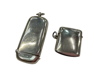 Lot 984 - Victorian silver combination vesta and sovereign case with engraved inscription (London 1896), together with a silver vesta case (London 1919)