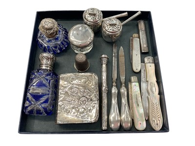 Lot 985 - Group of silver and white metal items to include silver and mother of pearl fruit knives, pair of silver infusers in the form of cooking pots with covers, scent bottles, miniature bible, Victori...