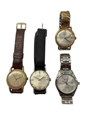 Lot 987 - Vintage Enicar gold plated stainless steel wristwatch on leather strap, Leeson wristwatch on leather strap, Ramona gold plated watch on expandable bracelet and a Sekonda stainless steel watch (4...
