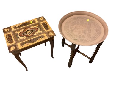 Lot 1480 - Musical inlaid table together with brass table on folding stand (2)