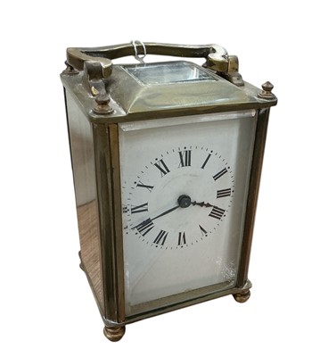 Lot 405 - Early 20th century brass carriage clock with white enamel dial.