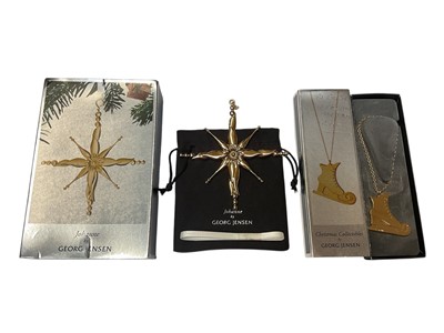 Lot 32 - Two Georg Jensen Christmas decorations to include Christmas Collectibles ice skate and Johanne star, both boxed