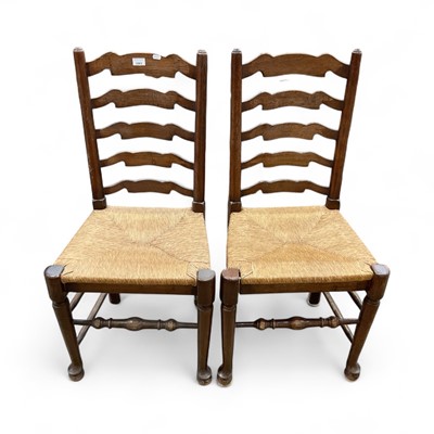 Lot 1503 - Set of four oak ladderback chairs with rush seats