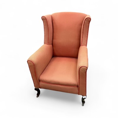 Lot 1508 - Early 20th century wingback armchair with striped upholstery