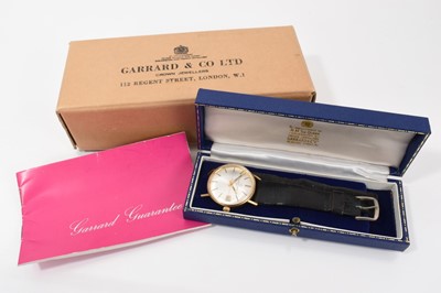 Lot 773 - Eterna-matic 9ct gold wristwatch, the silvered dial with applied baton markers and date aperture at 3 o'clock in a 9ct gold case, on a black leather strap in original Garrard box