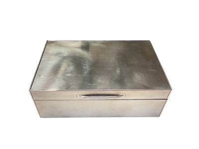 Lot 157 - George VI silver cigarette box of rectangular form with engine turned decoration, (London 1938), 14cm in overall length.