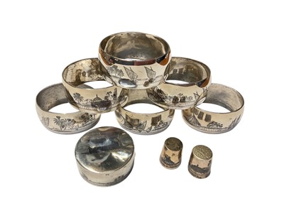 Lot 160 - Set of six white metal niello napkin rings (possibly Egyptian), together with a similar pill box and two thimbles, all at approximately 5ozs.