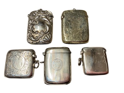 Lot 161 - Edwardian silver vesta case, (Birmingham 1909), together with two other silver vesta cases and two plated examples (5).