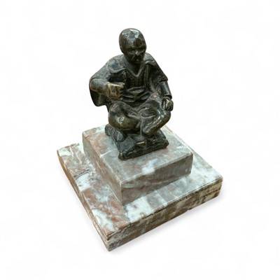 Lot 432 - Small bronze oriental figure of a seated man, raised on stepped marble base, 9cm in overall height.