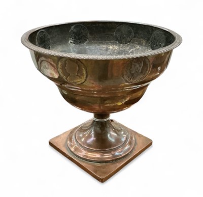 Lot 443 - Georgian copper pedestal bowl, mounted with copper pennies, 15.5cm in overall height.