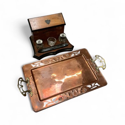 Lot 533 - Art Nouveau copper and brass tray with pierced and embossed decoration, together with an early 20th century desk stand, (2).