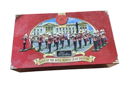 Lot 1817 - Britains diecast Band of the Royal Marine Light Infantry, boxed 40293, Trooping the Colur, boxed 40392, Sentry Box & Beefeater, boxed 00088, The Middlesex Regiment, in Perspex display cases...