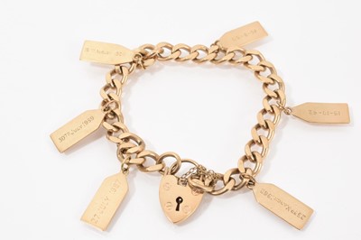 Lot 748 - 9ct gold flat curb link bracelet with a padlock clasp and six gold label tag charms with engraved names and dates