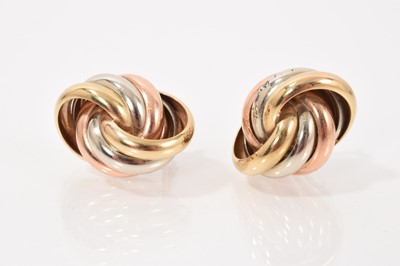 Lot 652 - Pair 9ct three colour gold knot style earrings (London import mark 1993)