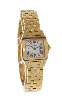 Lot 750 - Ladies' Cartier 'Santos Demoiselle' 18ct gold quartz wristwatch. Boxed with booklets, dated 2006.