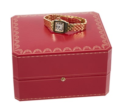 Lot 750 - Ladies' Cartier 'Santos Demoiselle' 18ct gold quartz wristwatch. Boxed with booklets, dated 2006.