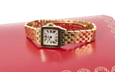 Lot 750 - Ladies' Cartier 'Santos Demoiselle' 18ct gold quartz wristwatch. Boxed with booklets, dated 2006.