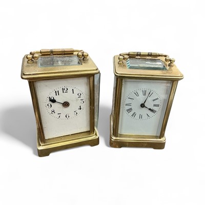 Lot 470 - Early 20th century brass carriage clock with white enamel dial, together with another similar, (2).