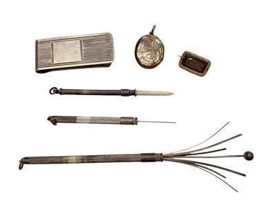 Lot 1045 - Regency mourning brooch, Victorian gold locket, silver money clip, silver cocktail twizzler, silver toothpick and one other