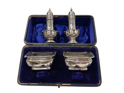 Lot 1041 - Pair of Edwardian silver salts in fitted box and a pair of silver pepperettes