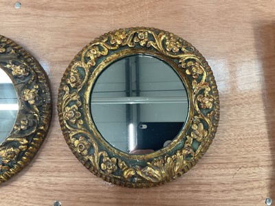 Lot 1205 - Pair of antique carved giltwood circular mirrors