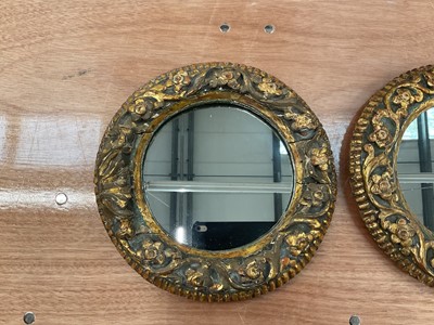 Lot 1205 - Pair of antique carved giltwood circular mirrors
