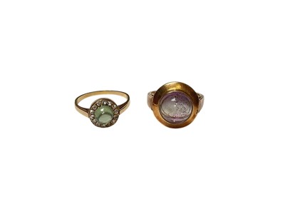 Lot 26 - Two gold dress rings to include a green cabochon and rose cut diamond cluster ring and an amethyst single stone ring (2)