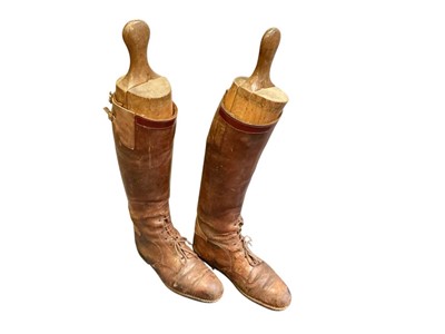 Lot 770 - Pair of early 20th century officers brown leather boots including shoe trees