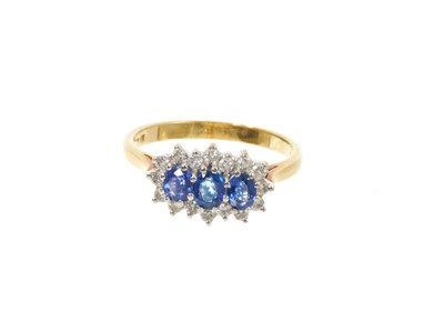 Lot 611 - Sapphire and diamond triple cluster ring in 18ct gold setting