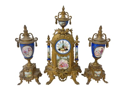 Lot 823 - Late 19th century French gilt metal and porcelain mounted clock garniture