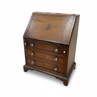Lot 1202 - Georgian style walnut miniature bureau