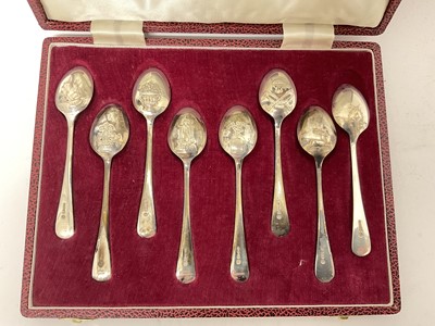 Lot 220 - Set of eight silver teaspoons with various images to the back of the bowls, in fitted case