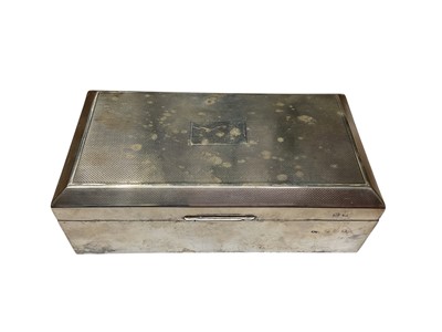 Lot 108 - George VI silver cigarette box of rectangular form with engine turned decoration and cedar wood lined interior, (Birmingham 1947), makers mark rubbed, 16.5cm in overall length.