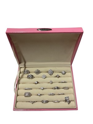 Lot 123 - Collection of 22 contemporary silver (925) cubic zirconia dress rings in a pink ring display box