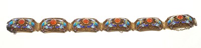 Lot 640 - Chinese silver gilt filigree bracelet, the six panels each set with carnelian cabochons and enamelled decoration, 17cm