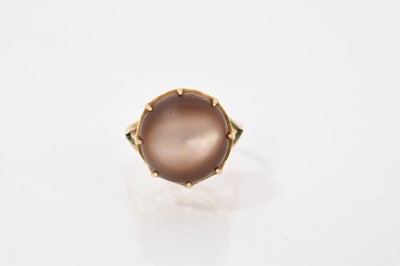 Lot 603 - Antique mother of pearl cabochon ring in eight claw setting with split shoulders on 9ct gold shank. Ring size L