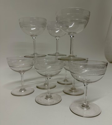 Lot 144 - Set of nine Edwardian champagne glasses with diamond cut band