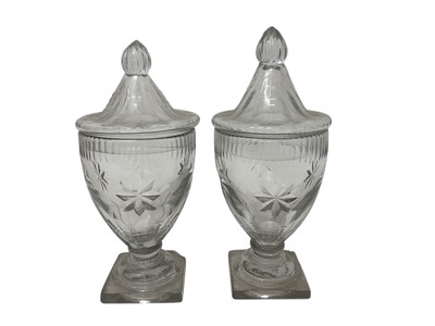 Lot 1921 - Pair of Georgian cut glass sweetmeat jars and covers, of grey metal, with star and facet cut decoration, 20cm and 21cm high
