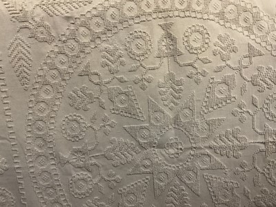 Lot 2522 - Antique cream cotton bedspread with raised tuffed floral design. Signed and dated - SF 12 in design.
