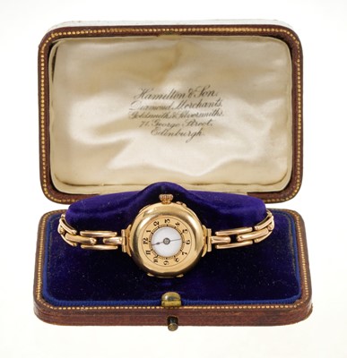 Lot 788 - Ladies' antique 15ct gold half hunter wristwatch, in a leather case
