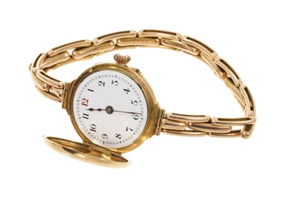 Lot 788 - Ladies' antique 15ct gold half hunter wristwatch, in a leather case