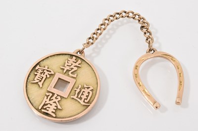Lot 737 - Chinese yellow metal coin pendant suspended on a chain with gold horseshoe fob, marked 14k
