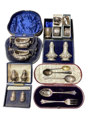 Lot 165 - Pair of Edwardian silver pepperettes, (Birmingham 1902), in a fitted case, together with silver cruets, christening pieces and other silver items, (various dates and makers)