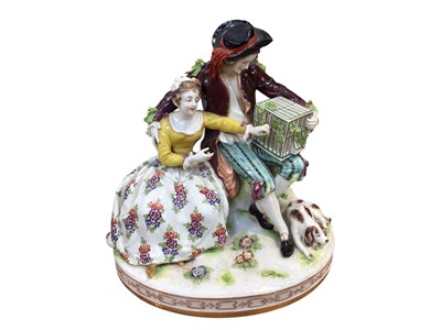 Lot 5106 - Continental porcelain figure group of two lovers with a bird cage