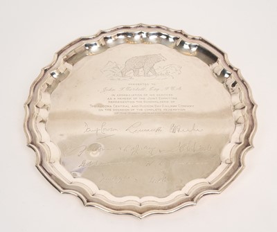Lot 424 - Mid twentieth century Canadian silver salver of circular form, on three bun feet, with piecrust border and engraved presentation inscription and signatures, referring to The Algoma Central and...